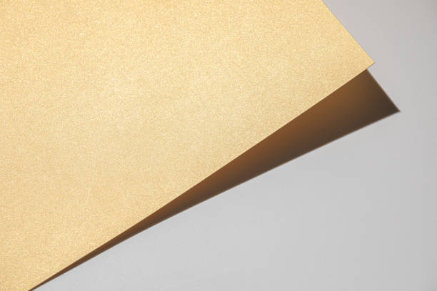 istock Golden cardbord on light gray background 1485522232