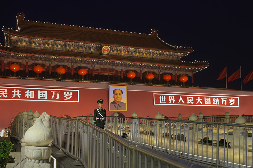 Beijing, China. October 6th, 2017: Soldier standing guard at the Tiananmen Gate or the Gate of Heavenly Peace. It is a monumental gatehouse that serves as the entrance to the Forbidden City, the former imperial palace of the Ming and Qing dynasties.
