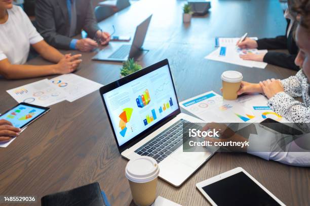 Group Of Business People Working At A Conference Table Stock Photo - Download Image Now