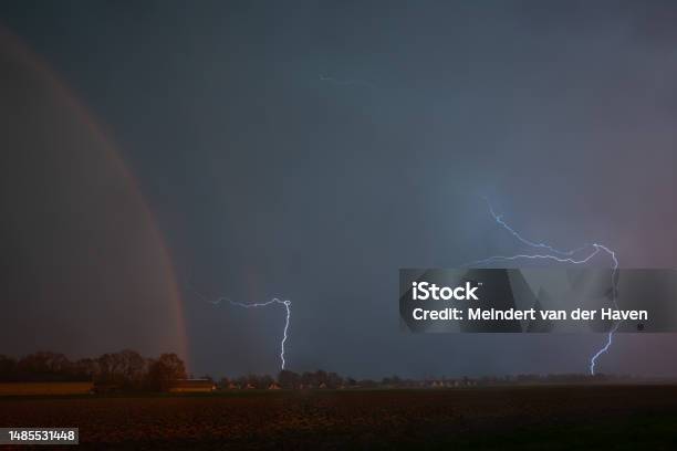 Lightning Storm With Rainbow Stock Photo - Download Image Now - Agricultural Field, Agriculture, Atmosphere
