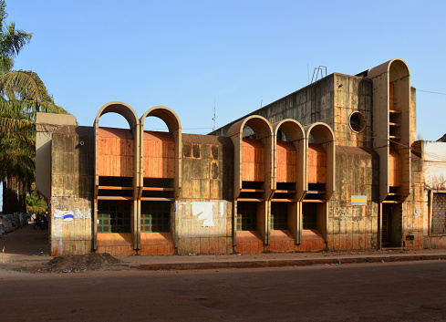 Bissau, Guinea-Bissau: abandoned headquarters of the International Bank of Guinea-Bissau ('Banco Internacional da Guiné- Bissau', BIGB) - African brutalism designed by USSR trained architects - decaying neo-colonial architecture on Amilcar Cabral Avenue.