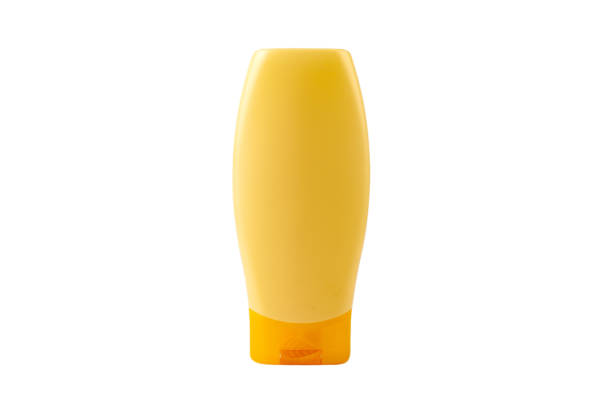 One single new clean blank generic yellow shampoo bottle, object isolated on white, cut out, front view, empty mockup template, no label, no logo. Bathroom supplies, beauty, hygiene product container