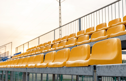 Red seats for fans at a soccer stadium