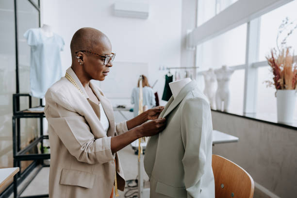 istock Woman fixing blazer on mannequin 1485534762