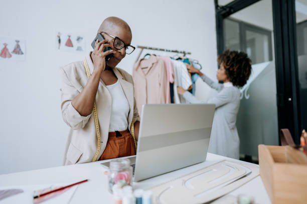 istock Clothing store manager talking on smartphone 1485535415
