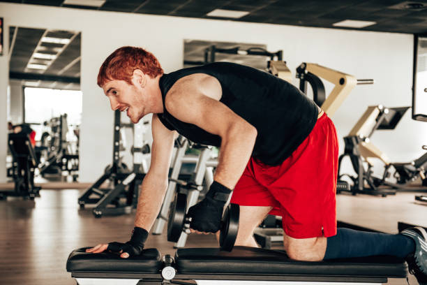 istock man with dumbell at the gym 1485535894