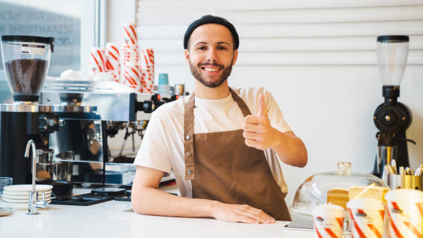 istock Happy coffee shop owner raised his thumb up 1485536177
