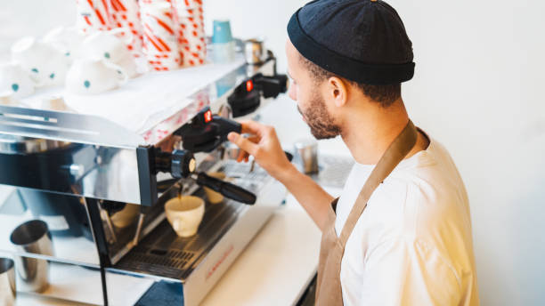 istock Male barista making coffee. Preparation service concept 1485536178