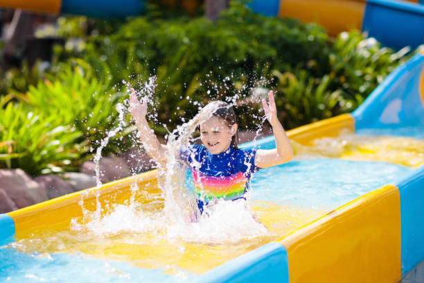 istock Kids on water slide in aqua park. Summer vacation 1485540088