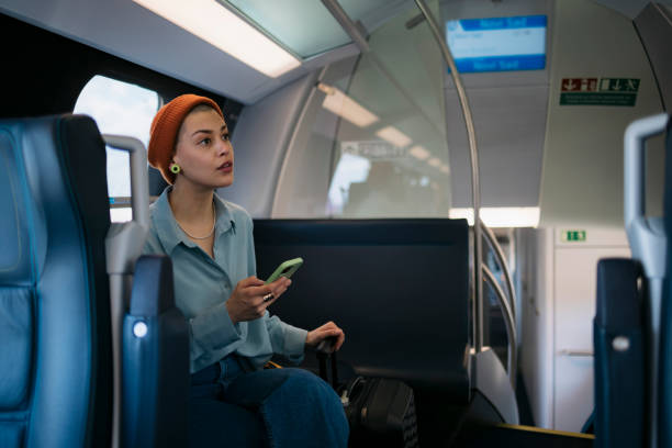 istock Young woman on holiday traveling by train 1485543568