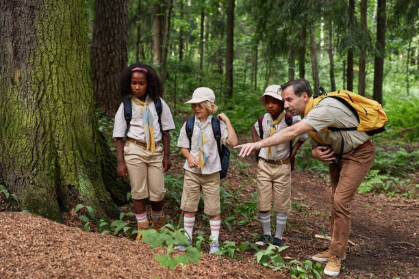 istock Group of scouts exploring nature during field trip 1485544286