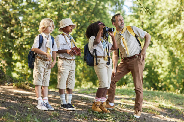 istock Side view little girl scout looking in binoculars 1485546217