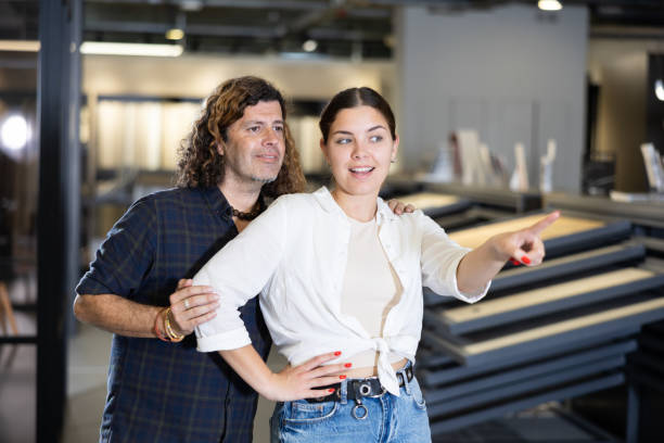 istock Woman and man points his hand at something in hardware store 1485549576