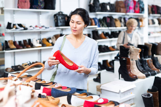 istock Focused Asian woman chooses ballet flats 1485549647