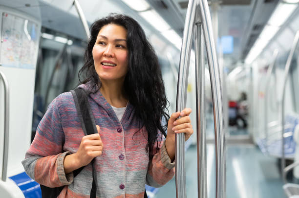 istock Young woman passenger sitting in subway car 1485549662