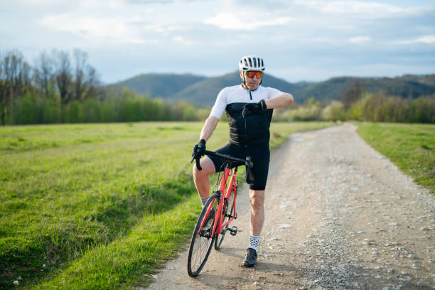 istock Senior man on a bike exercise in nature. 1485576763