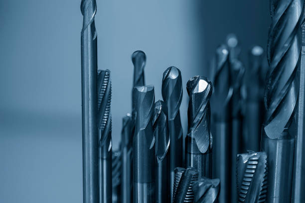 Close-up scene group of the used solid end mill in the light blue scene. stock photo