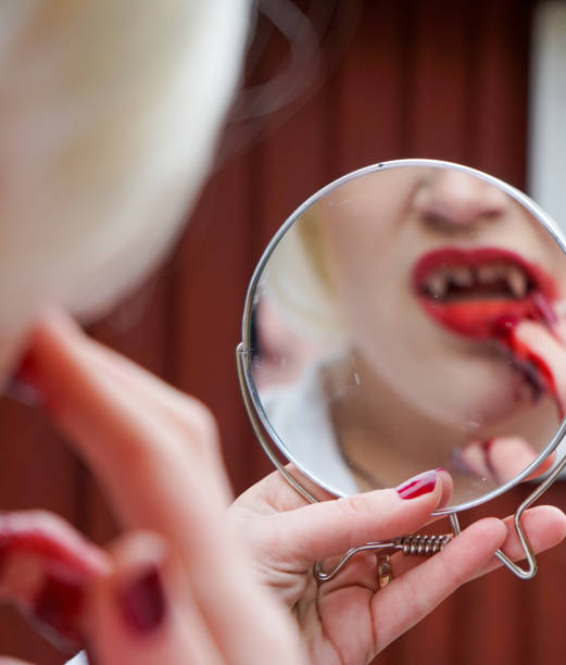 istock Portrait of a vampire looking in a mirror 1485579078