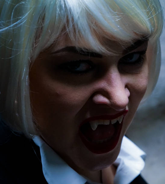 istock Portrait of a vampire showing her teeth 1485579147