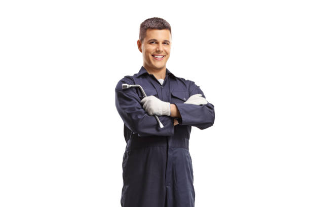 istock Mechanic holding a wrench and smiling 1485584868