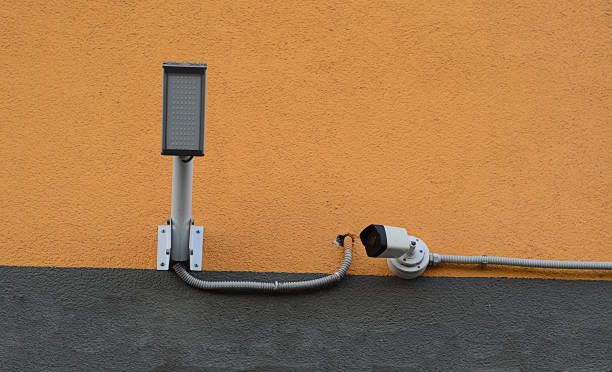istock camera for security with lamp on house wall 1485590869