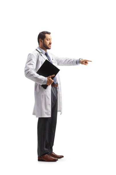 istock Young male doctor standing and pointing with a finger 1485595581