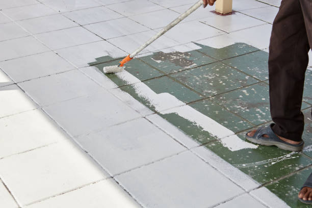 istock Worker holding  paint roller and painting footpath 1485603010