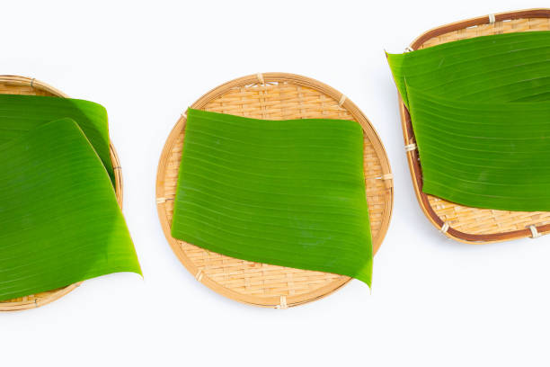 istock Banana leaves in bamboo weave plate on white background. 1485605628