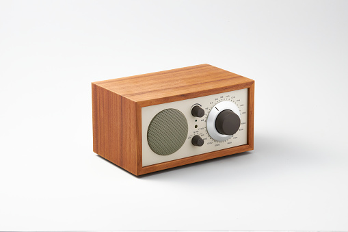 A wooden radio with a classic look that plays sweet\nmusic