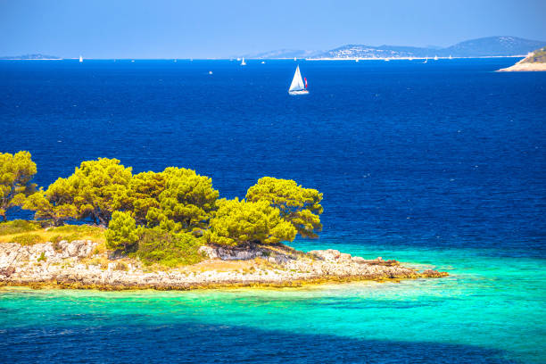 Idyllic Adriatic stone beach on island near Primosten view, archipelago of Dalmatia, Croatia