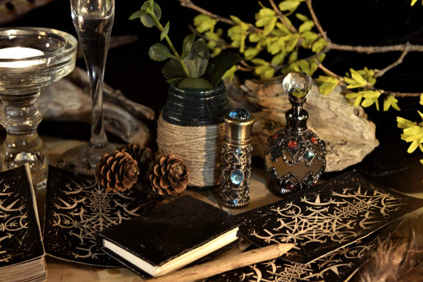 istock Esoteric and occult still life with vintage magic objects, tarot cards, book and candle on witch table altar for mystic rituals and fortune telling. Halloween and gothic background 1485625342
