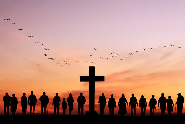 Christian people group worship God Jesus Christ together Large group of people stand near cross against backdrop of sunset, resurrection of Easter Sunday concept christianity stock pictures, royalty-free photos & images