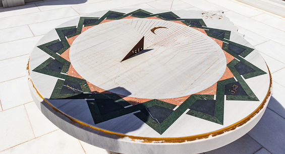 Shot of the arabic outdoors sun clock