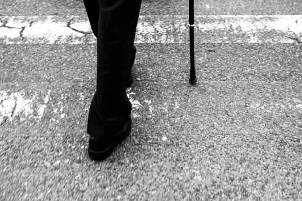 Image of a man's leg with a cane