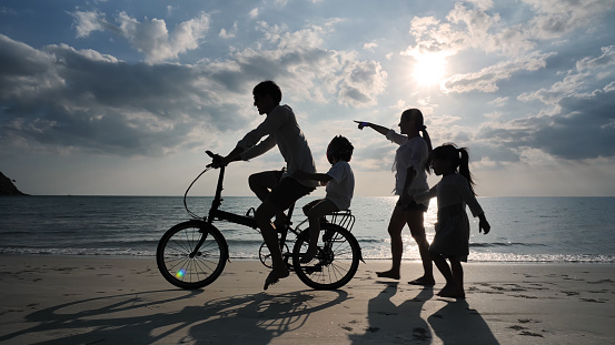 Happy Asian Family on the Beach