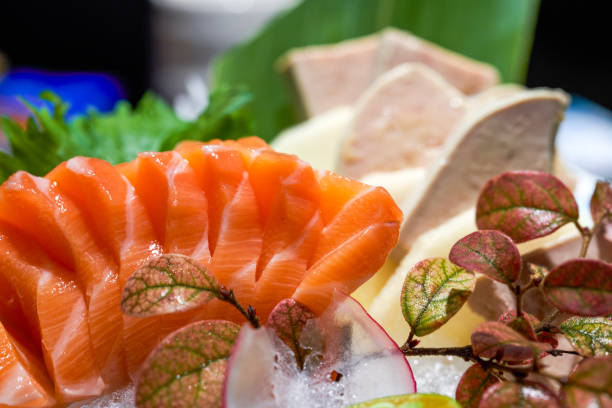 A delicious Japanese dish, salmon and foie gras sashimi platter A delicious Japanese dish, salmon and foie gras sashimi platter frigate mackerel stock pictures, royalty-free photos & images