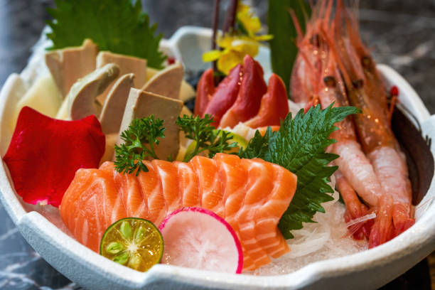 A delicious Japanese dish, salmon and foie gras sashimi platter A delicious Japanese dish, salmon and foie gras sashimi platter frigate mackerel stock pictures, royalty-free photos & images