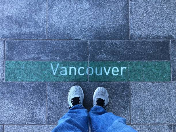 istock Standing at Vancouver BC Sign 1485642178