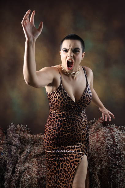 Displeased Party woman throwing bottle in anger. Displeased Party woman throwing bottle in anger. Mad sexy young woman in isolated background screams annoyed. Loud noise, furious angry millennial Indian girl yell shout bothered by noisy disturbing sound. vex nightclub stock pictures, royalty-free photos & images