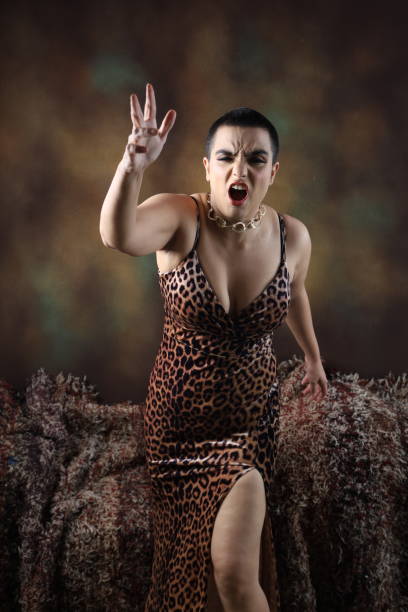 Displeased Party woman throwing bottle in anger. Displeased Party woman throwing bottle in anger. Mad sexy young woman in isolated background screams annoyed. Loud noise, furious angry millennial Indian girl yell shout bothered by noisy disturbing sound. vex nightclub stock pictures, royalty-free photos & images