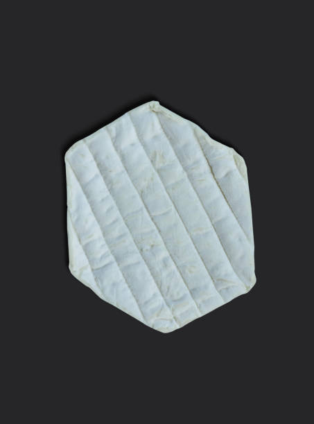 istock organic farm cinder goats cheese from Normandy against a black background 1485644730