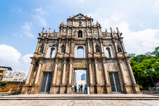 Macau- September 17, 2019: Tourists visit the Ruins facade of St.Paul's Cathedral in Macau, a historic architectural landmark of Macau. The place is one of the UNESCO World Heritage.
