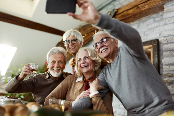 istock Happy seniors taking a selfie during a meal at home. 1485645497