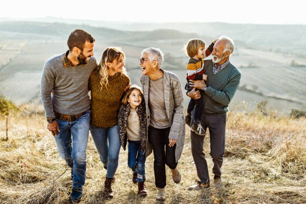 istock Happy multi-generation family talking while taking a walk on the field. 1485646605