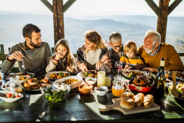 istock Happy extended family enjoying during lunch on a terrace. 1485648348