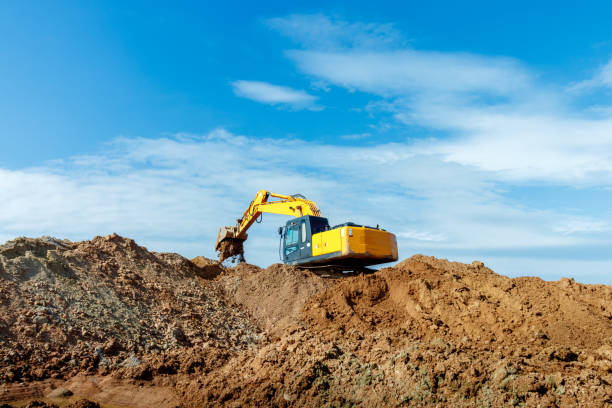 istock Excavator dig the trenches at a construction site. Trench for laying external sewer pipes. Sewage drainage system for a multi-story building. Digging the pit foundation 1485650465