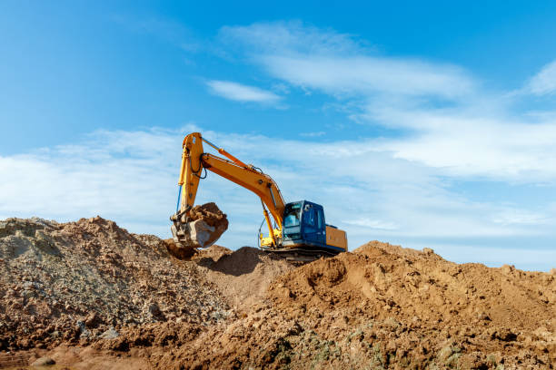 istock Excavator dig the trenches at a construction site. Trench for laying external sewer pipes. Sewage drainage system for a multi-story building. Digging the pit foundation 1485650479