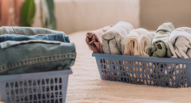 istock Laid out clothes in blue containers on the bed 1485651783