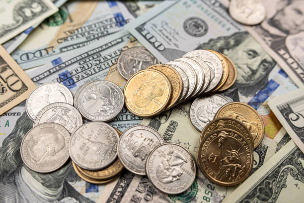 istock different United States dollar bills with coins for background 1485653803