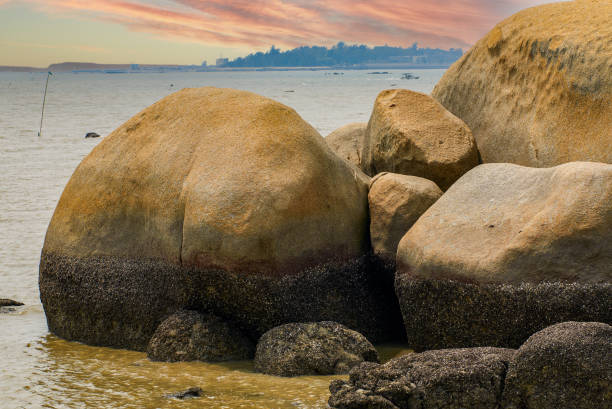 istock Crushed stones and huge rocks on the beach 1485654116